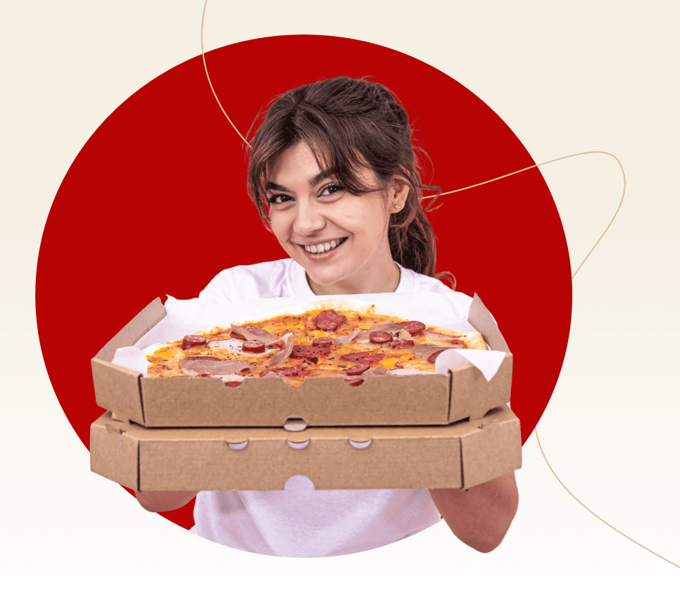 Smiling person holding two pizza boxes